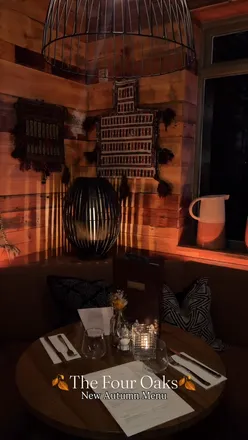 Guests enjoying a cozy meal at The Four Oaks gastropub in Sutton Coldfield, featuring an autumn menu and outdoor seating.