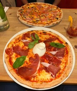 Delicious burrata pizza served at Eat My Pizza in Leytonstone, perfect for a rainy Monday morning.