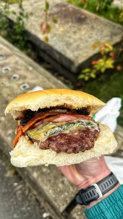 Delicious burgers served at Two Valleys Café in Meltham, featuring a cozy deli atmosphere.