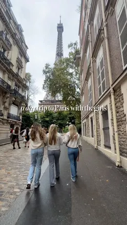 Friends enjoying a day in Paris, sipping champagne at lunch and visiting iconic sights like the Eiffel Tower.