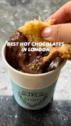 Three cozy hot chocolates to try in London: Gelateria Danieli, Italian Bear, and Badiani with unique toppings.