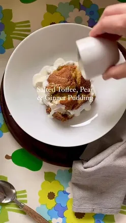 Delicious Salted Toffee, Pear & Ginger Pudding served with cream, perfect autumn dessert for six at a cozy home gathering.