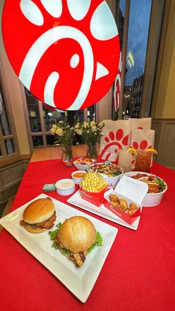 Sneak peek of Chick-fil-A's menu in Leeds before grand opening, featuring fried chicken and burgers.