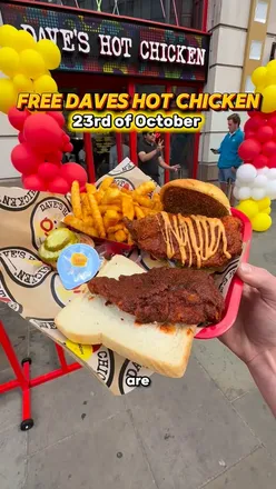 Delicious Dave’s Hot Chicken burger with fries at a trendy restaurant