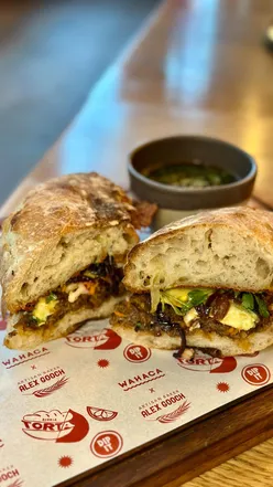 Birria torta special with slow-cooked beef, grilled cheese, and pickled veg at Wahaca in Cardiff, created with Alex Gooch.
