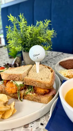 Brunch at Eastwood Twelve features hot honey chicken sandwich, carrot soup, and stunning golf course views in Newton Mearns.