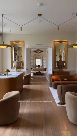 Visitors exploring the 400-year-old RH England estate at Aynho Park, enjoying brunch with views of lush countryside.