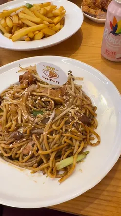 Delicious dishes at Gyocurry Birmingham: Beef Brisket Udon, Chicken Yakisoba, Katsu, Teriyaki Skewers, and Salt & Pepper Chips.