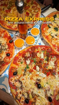 Pizza Express diners enjoying new Autumn Menu dishes, including Pizzanaise dip, truffle dough balls, and unique pizzas.