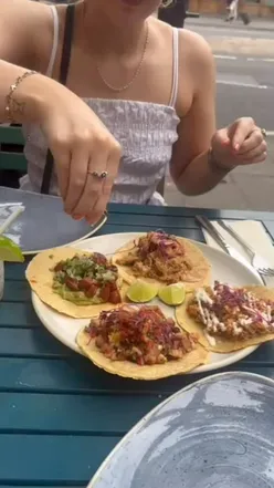 Enjoying tacos with lime at Batida in Bristol – a must-visit for Mexican food lovers!