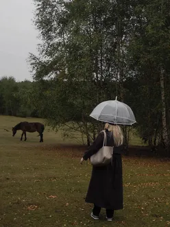 Couple enjoying a cozy autumn picnic in the Cotswolds, surrounded by vibrant fall foliage and a heartfelt atmosphere.