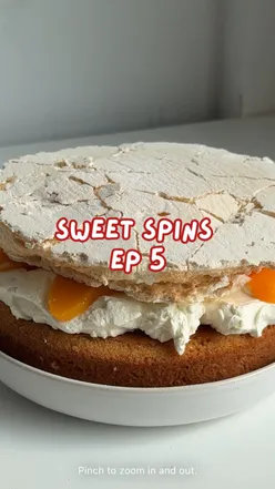 Baking a peaches and cream meringue cake inspired by The Carpenters' album 'The Singles' in a cozy London kitchen.