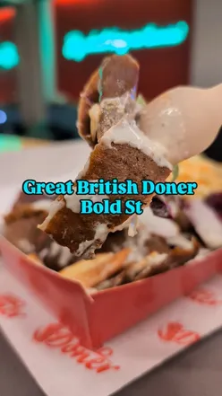 Delicious vegan doner on a spit at Great British Doner, Bold Street, with diverse options including falafel and sauces.