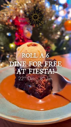 Friends enjoying Argentine steak at Fiesta del Asado, promoting 'Roll a 6 & Dine for FREE' offer in Birmingham.