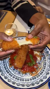 Diners enjoying a festive meal at Prezzo in Reading, featuring various Italian dishes and desserts.