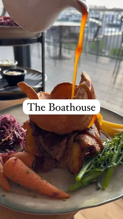 Epic Sunday roast tower with fresh veggies, pork belly, and brisket at The Boathouse Swanwick by the water.