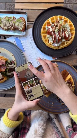 Delicious brunch at Utter Waffle featuring gourmet waffles, truffle hash browns, and festive foodie surprises!