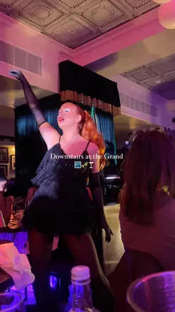 Guests enjoying a cabaret show with fine dining and Prosecco at Isaac’s in Birmingham’s Grand Hotel.