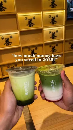 Person enjoying a matcha latte and cookies at a coffee shop, reflecting on their new matcha obsession.
