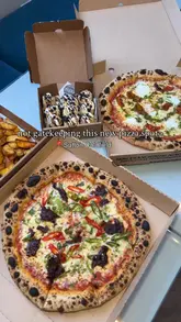 Diners enjoying Korean Beef Pizza and Royale Pizza at the family-run Real Pizza Company in Sutton Coldfield.