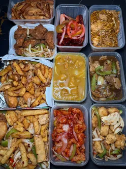 Delicious spread of chicken and ham fried rice, ribs, and crispy chicken curry at Fantasty Wok in Holytown.