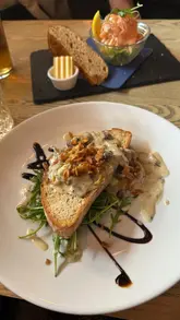 A montage showcasing the atmosphere, menu, and food dishes at The Ley Arms, a pub in Kenn.