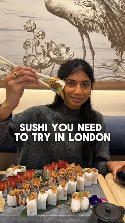 Delicious sushi and hot dishes at The Sushi Co, featuring spicy chicken bao and seared sea bass nigiri in London.