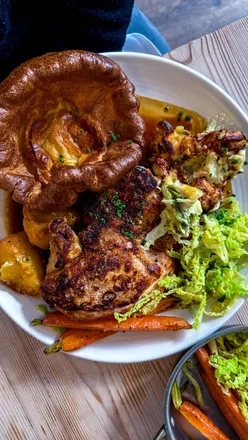 Delicious Sunday roast with chicken, beef, crispy potatoes, and veggies at 1 York Place, Clifton, Bristol.