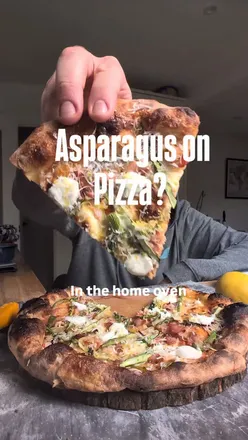 Delicious asparagus pizza baked at home, showcasing unique toppings and quality kitchen tools for a perfect meal.