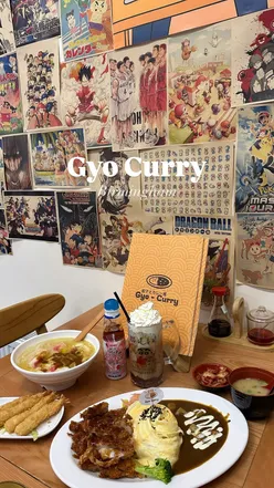 Delicious chicken katsu omelette curry and seafood udon at Gyo Curry in Birmingham, with cozy décor and inviting atmosphere.