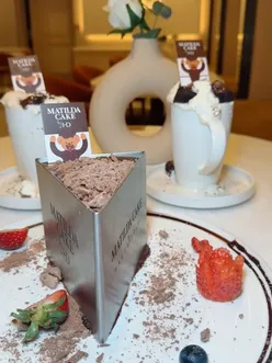 Iconic Matilda cake and Hot Chocolate served at Haute Dolci in Birmingham, a viral dessert destination.