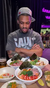 A review of Robin's Ramen located within the Supermarket of Dreams in London. The video features the creator trying various dishes including ramen, battered squid, and duck gyoza, while also showing the kitchen preparation and the venue's unique setting.