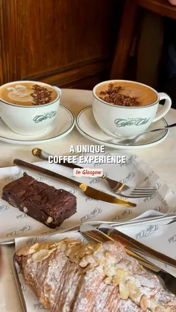 Coffee lovers enjoy cappuccinos, mochas, and pastries at Paragon Coffee Club, a unique café-barbershop in Glasgow.