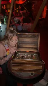 Charming cocktails at Tiki Hideaway, Leeds, featuring flaming Zombies and a treasure chest sharing drink.