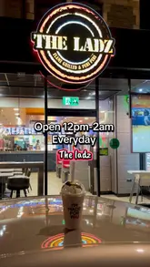 A short promotional video showcasing the preparation and serving of a smash burger, fries, and a milkshake at a casual burger venue.
