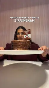 A short, energetic video featuring a creator reviewing the 'Matilda Cake in a Mug' at Haute Dolci in Birmingham. The video uses quick cuts, voiceover, and close-up shots of the dessert being prepared and eaten to highlight the product for World Chocolate Day.