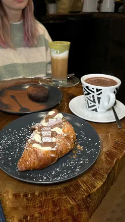 Customers enjoying pastries and coffee at Bonincontro Cafe, a new Italian coffee house in Nottingham city centre.