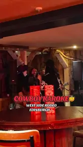 The video showcases West Side Rodeo in Edinburgh, highlighting their 'cowboy karaoke' concept. It features shots of the venue's interior, people singing karaoke, and close-ups of various cocktails. The creator is present throughout, enjoying the drinks and the atmosphere.