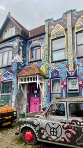 A visual tour of The Mosaic House in Chiswick, London, highlighting the intricate ceramic tile work on the exterior of the building and the decorated car parked outside.