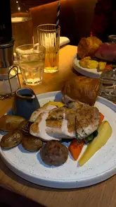 Delicious roast from La Storia in West Bridgford, showcasing vibrant flavors and comfort food on a plate.