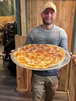 Announcement for new pizza venture @slicespizza2go, featuring slices, whole pizzas, and Italian sandwiches.