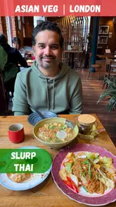 A couple visits Slurp Thai in Spitalfields, London, to review their vegetarian-friendly menu. They showcase the interior, the menu, and several dishes including dumplings, noodle soup, drunken noodles, and lemongrass tea, providing their ratings for each.