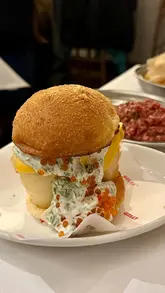 A review of Belly Bistro in London, featuring a variety of dishes including Filipino-European fusion, cocktails, and the viral Ube Tiramisu.