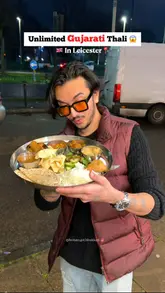 A high-energy vlog-style review of an Indian restaurant in Leicester, showcasing their unlimited Gujarati and Kathiyawadi thalis. The creator highlights the variety of dishes, the authentic taste, and the service experience.