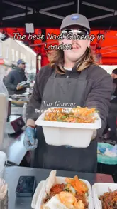 A short, punchy reel featuring the preparation of Nasi Goreng at a street food stall in Broadway Market. The video focuses on the cooking process, showing the ingredients being tossed on a hot grill, the plating, and the final dish.