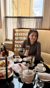 A short, aesthetic video showcasing an afternoon tea experience at Rails restaurant, located in the Great Northern Hotel. The video features close-up shots of the tea stand, including scones, sandwiches, and petit fours, alongside shots of the elegant Victorian-style interior and the creator enjoying the service.