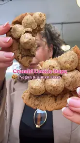 A short vlog-style video featuring a visit to The After School Cookie Club, highlighting their range of vegan and gluten-free cookies. The creator showcases the shop exterior, the display case, and takes a bite of a cookie, positioning it as a 'Crumbl' alternative.