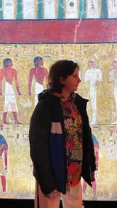 A family visits the Ramses and the Pharaohs' Gold exhibition at Battersea Power Station, featuring ancient artifacts, a VR experience, and a personalized papyrus souvenir, followed by a ride on the Battersea Land Train.