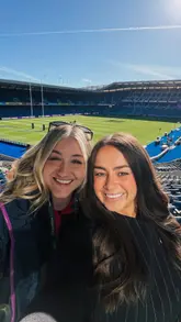 A vlog-style video showcasing a hospitality experience at Scottish Gas Murrayfield during a rugby match. The creator captures the atmosphere of the stadium, interviews attendees, and shows the interior of the hospitality suite.