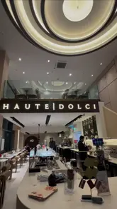 A short, aesthetic montage showcasing the interior of Haute Dolci in Deansgate, Manchester, and highlighting their new Ramadan Iftar menu, featuring various dishes and drinks.